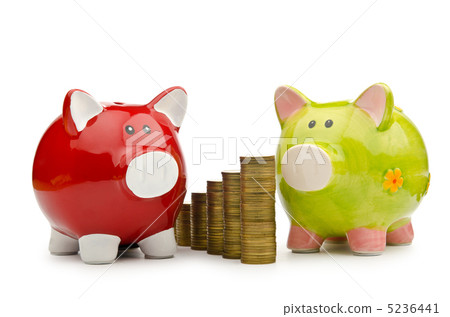 Piggy bank and coins isolated on white Piggy bank and coins isolated on white 5236441
