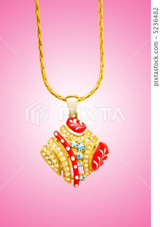 Golden jewellery against gradient background 5236482