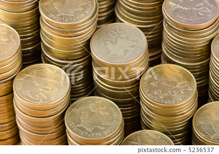 Golden coins in high stacks Golden coins in high stacks 5236537
