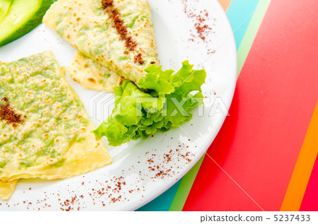 Pancake with herbs in the plate 5237433