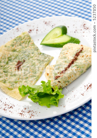 Pancake with herbs in the plate Pancake with herbs in the plate 5237850