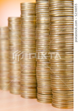Golden coins in high stacks 5238055