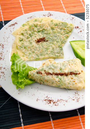 Pancake with herbs in the plate 5238075