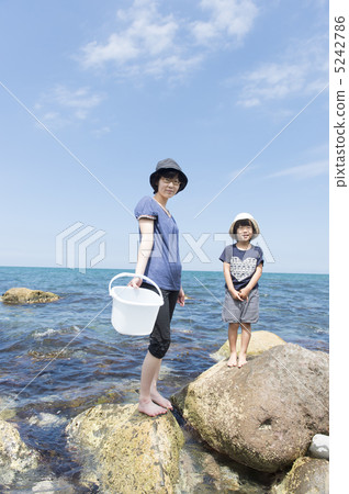 Swimming in the sea (mother and daughter) Swimming in the sea (mother and daughter) 5242786