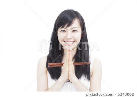 A woman holding chopsticks 5243008