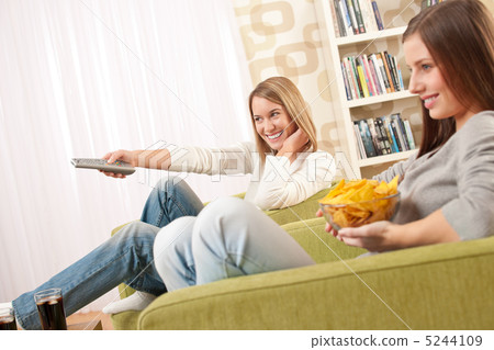 Students - Two female teenager watching television 5244109
