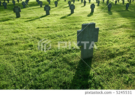 Cemetery with grass during sunset Cemetery with grass during sunset 5245531
