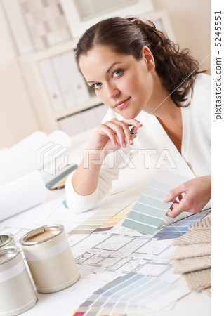 Young female interior designer working at office Young female interior designer working at office 5245551