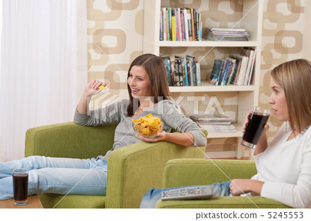 Students - Two female teenager watching television 5245553