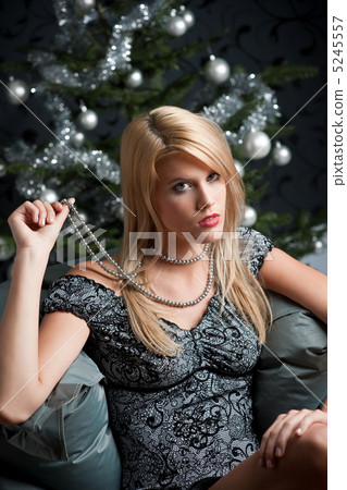Provocative woman posing in front of Christmas tree Provocative woman posing in front of Christmas tree 5245557