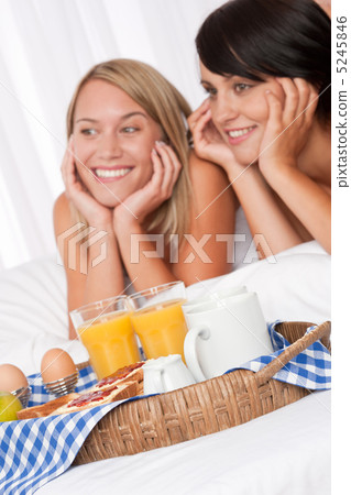 Home made breakfast, two women in background Home made breakfast, two women in background 5245846