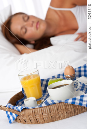Young woman having home made breakfast Young woman having home made breakfast 5245848