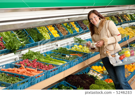 Grocery store shopping - Woman holding spring onion Grocery store shopping - Woman holding spring onion 5246283