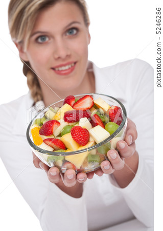 Healthy lifestyle series - Woman holding bowl of fruit salad 5246286