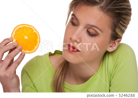 Healthy lifestyle series - Woman holding slice of orange Healthy lifestyle series - Woman holding slice of orange 5246288