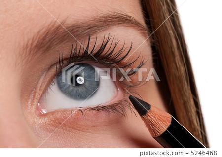 Blue eye, woman applying black make-up pencil Blue eye, woman applying black make-up pencil 5246468