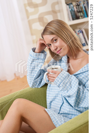 Students - Female teenager wearing pajamas relaxing 5247229