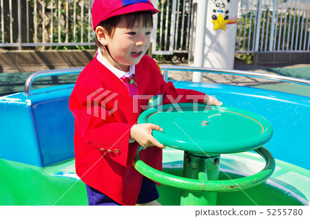 Kindergarten child playing with playground equipment 5255780