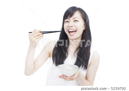 Girl eating rice 5259792