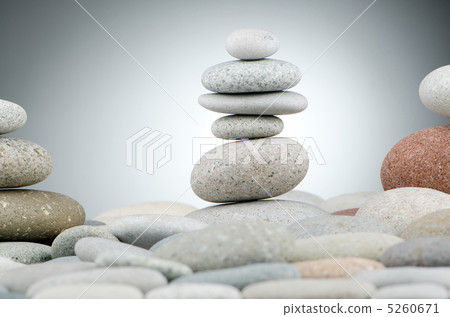 Pebbles stack against gradient background Pebbles stack against gradient background 5260671