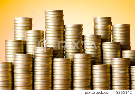 Golden coins in high stacks Golden coins in high stacks 5265142