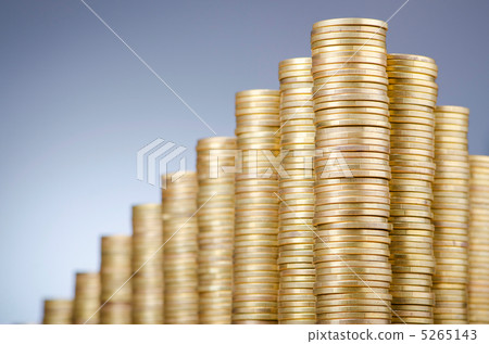 Golden coins in high stacks Golden coins in high stacks 5265143