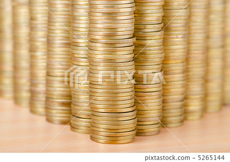 Golden coins in high stacks 5265144