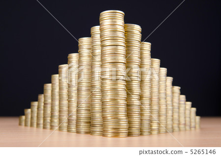 Golden coins in high stacks Golden coins in high stacks 5265146