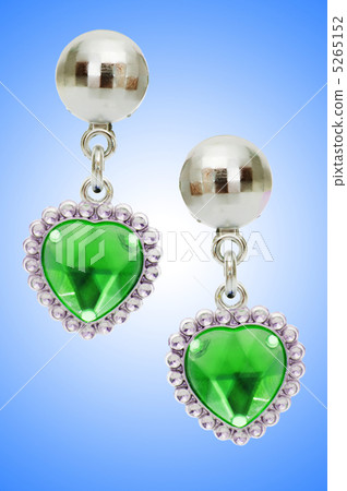 Silver earrings isolated on the white background Silver earrings isolated on the white background 5265152