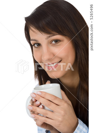 Happy young woman with coffee in pajamas 5265496