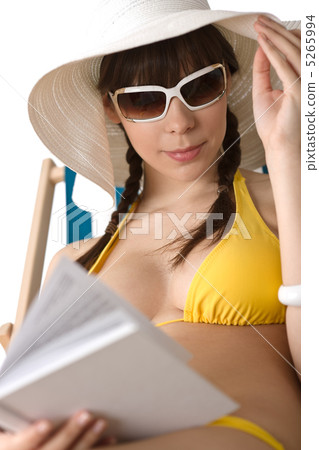 Beach - Young woman in bikini sunbath with book 5265994
