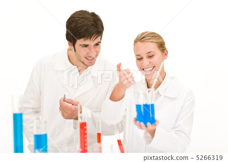 Scientists in laboratory test chemicals Scientists in laboratory test chemicals 5266319