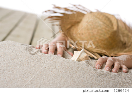 Naked woman sunbathing on beach 5266424