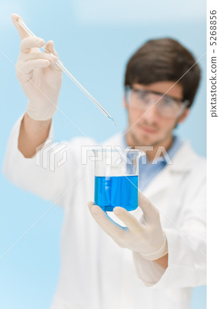 Chemistry experiment -  scientist in laboratory 5268856