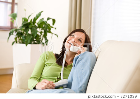 On the phone home: Happy woman calling On the phone home: Happy woman calling 5271059