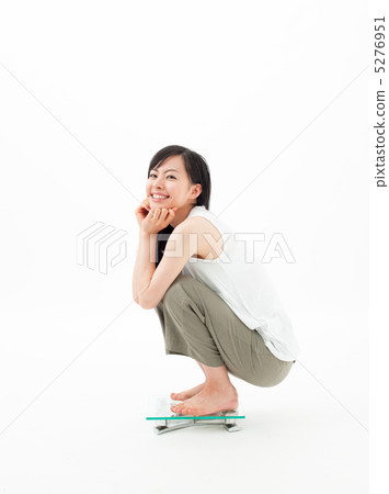 Girl riding a scale 5276951