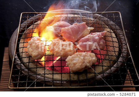 Charcoal grilling of chicken Charcoal grilling of chicken 5284071