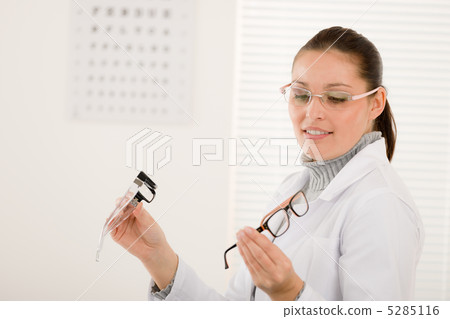 Optician doctor woman with glasses and eye chart Optician doctor woman with glasses and eye chart 5285116