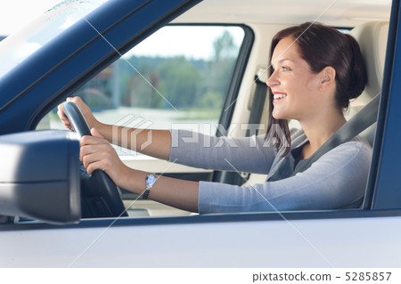 Attractive businesswoman drive luxury car Attractive businesswoman drive luxury car 5285857