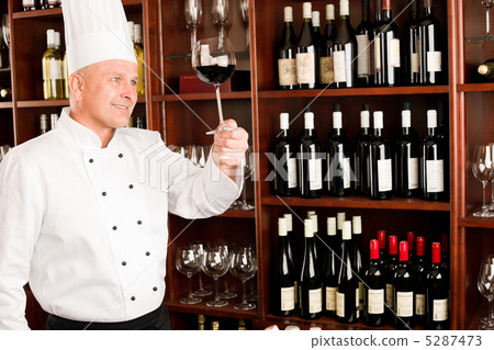 Chef cook hold wine glass in restaurant 5287473