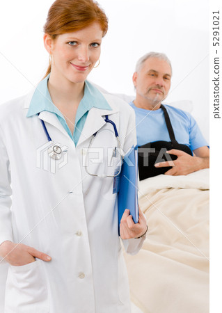 Hospital - doctor examine patient broken arm Hospital - doctor examine patient broken arm 5291021