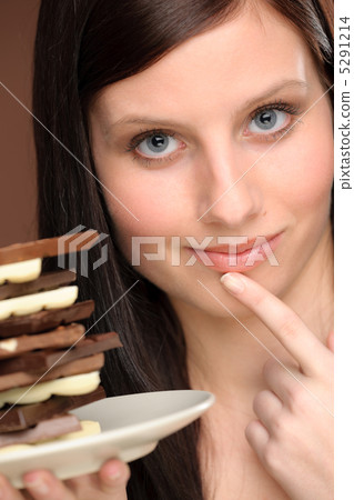 Chocolate - portrait young woman temptation 5291214