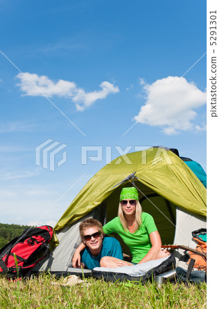 Camping couple lying inside tent summer countryside Camping couple lying inside tent summer countryside 5291301