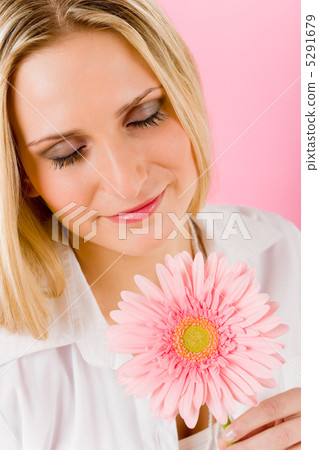 Romantic woman hold pink gerbera daisy flower Romantic woman hold pink gerbera daisy flower 5291679