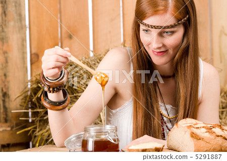 Red-hair young hippie woman have breakfast in barn 5291887