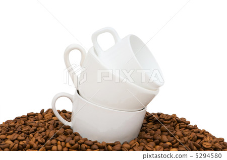 Cups and coffee beans isolated on the white Cups and coffee beans isolated on the white 5294580