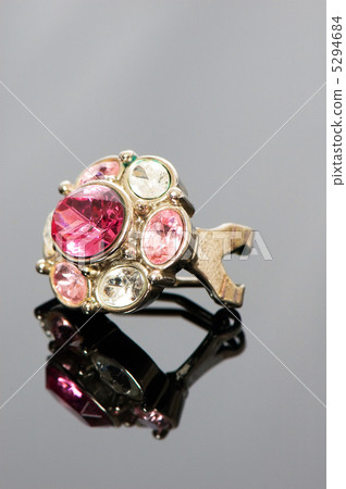 Ring with flower ornament on reflective background Ring with flower ornament on reflective background 5294684