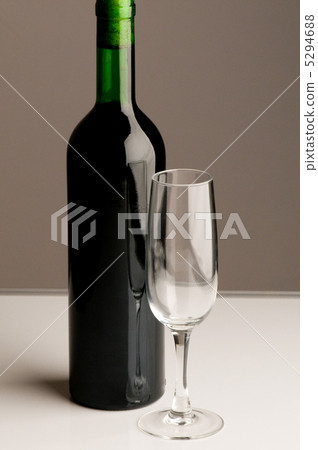 Bottle and wine glass on dark background 5294688