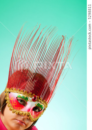 Attractive woman posing in the stylish mask Attractive woman posing in the stylish mask 5298811