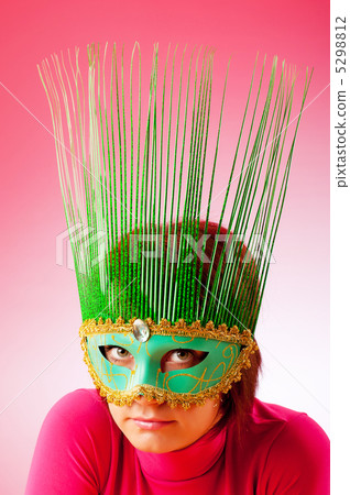 Attractive woman posing in the stylish mask Attractive woman posing in the stylish mask 5298812